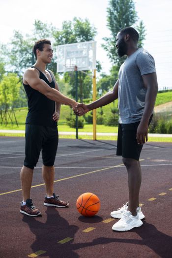 men-shaking-hands-long-shot